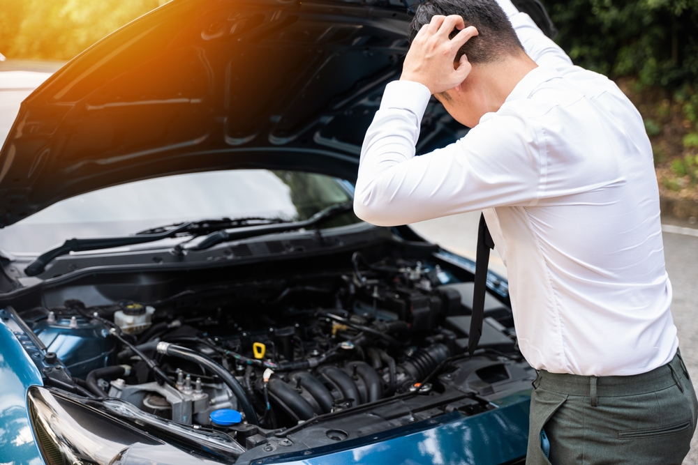 inspecting a car during an MOT test at Nork Motor Engineering in Banstead, Surrey